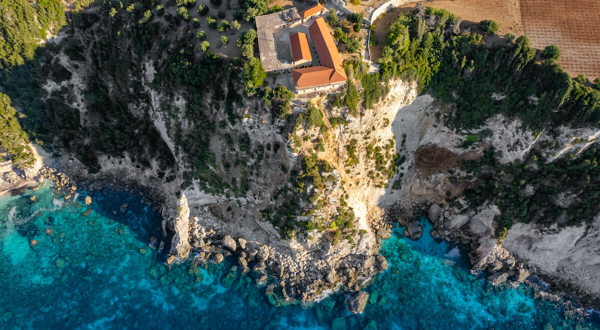 Discover the serene Monastery of Kipoureon, a spiritual sanctuary perched on a cliffside in Kefalonia, Greece. This historic monastery offers a tranquil and picturesque setting for reflection and contemplation. Admire the monastery's traditional architecture, with its stone walls and red-roofed buildings, against the backdrop of the deep blue Ionian Sea. Explore the beautifully adorned interior, filled with religious icons, frescoes, and ornate decorations. From the monastery's elevated position, take in the panoramic views of the surrounding landscape and the distant horizon. The Monastery of Kipoureon is a place of peace and spirituality, inviting visitors to experience the sacred atmosphere and connect with the rich cultural heritage of Kefalonia